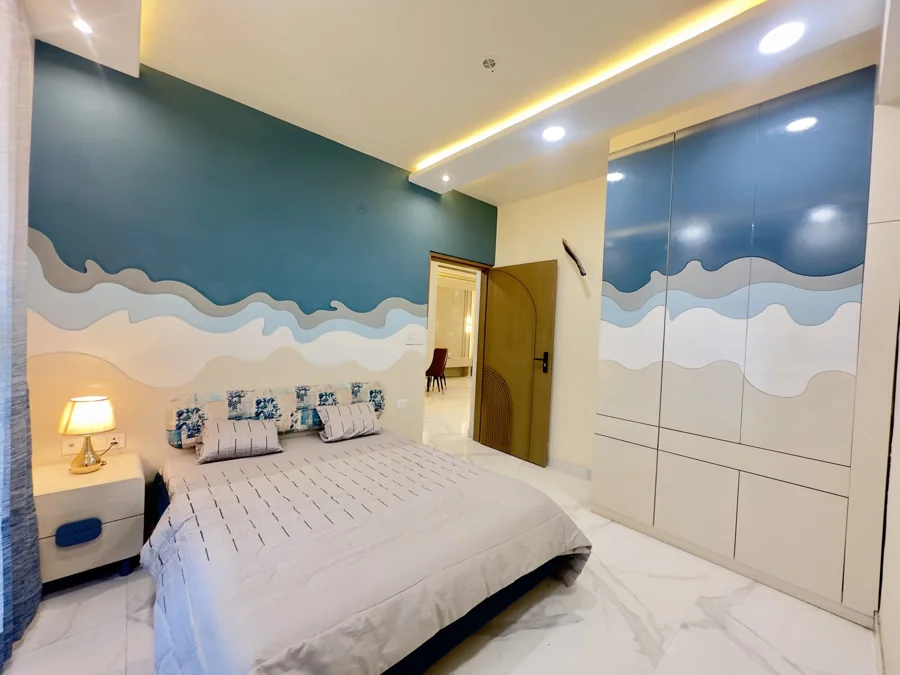 Kalyan EVA actual 3 BHK flat · Bedroom with blue feature wall